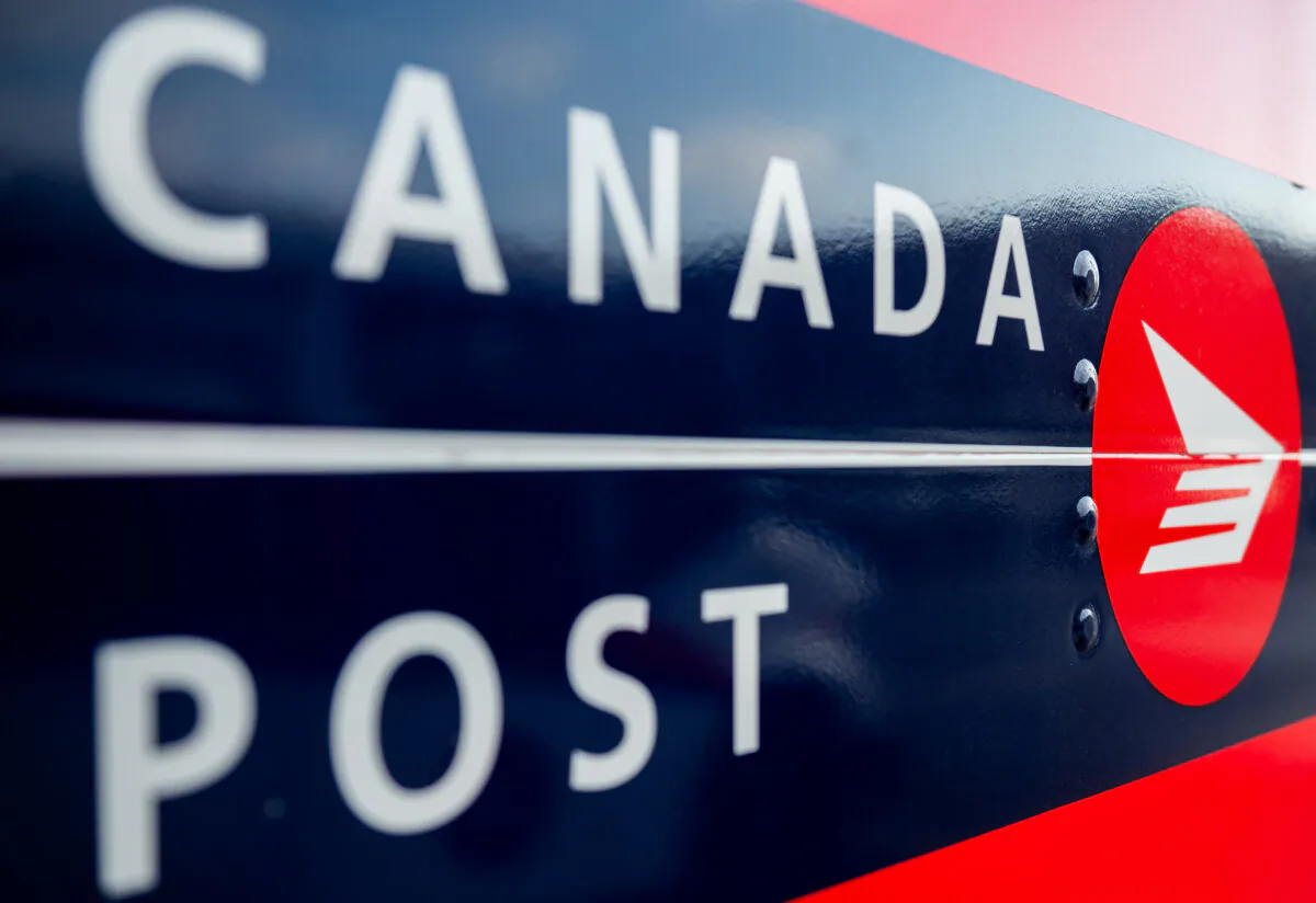 Canada Post signage is seen during a national strike action in Ottawa, on Nov. 18, 2024. (The Canadian Press/Spencer Colby)