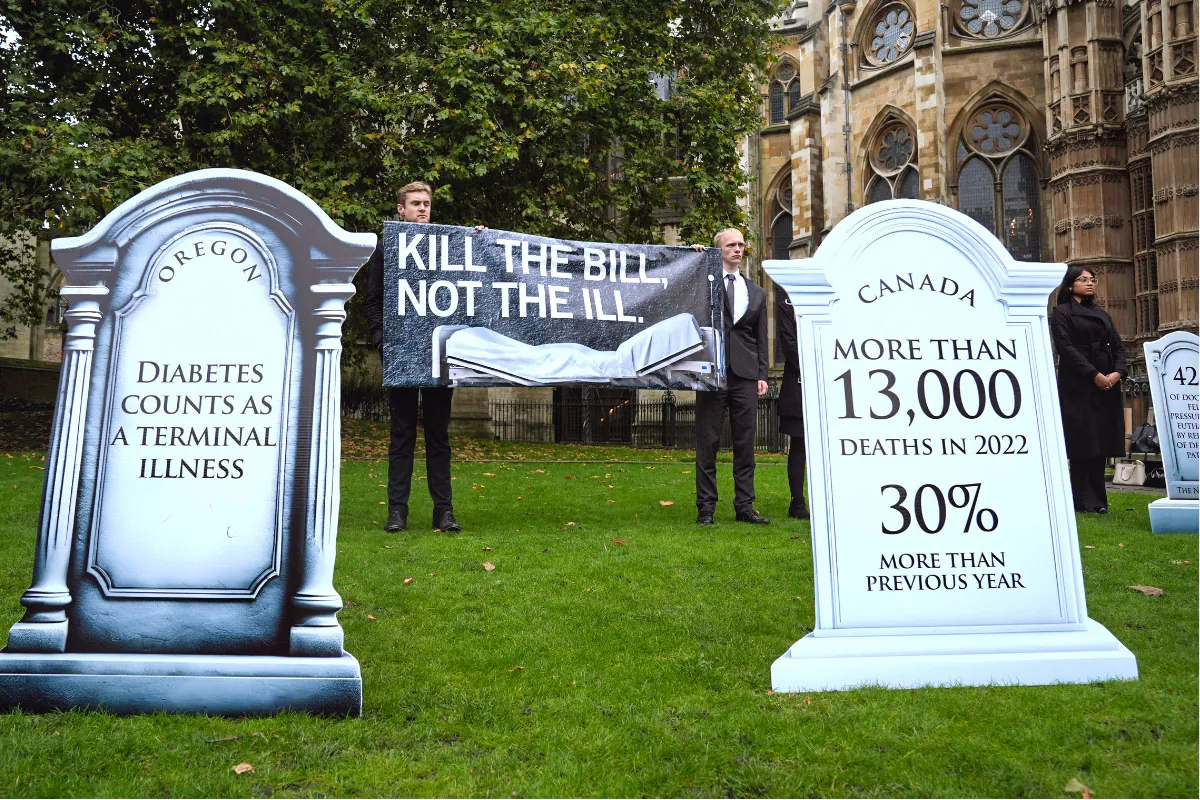 Members of Distant Voices, Christian Concern, the Christian Medical Fellowship, and SPUC gather to protest the assisted suicide bill in Westminster, London, England, on Oct. 16, 2024. (Lucy North/PA Wire)