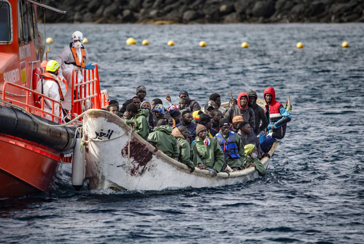 A ‘cayuco’ boat from Mauritania with 78 migrants onboard arrives after being rescued at sea by the Spanish Salvamento Maritimo (Sea Search and Rescue agency) Salvamar Acrux vessel, at La Restinga port on the Canary island of El Hierro, Spain, on Nov. 23, 2024. (Antonio Sempere/AFP via Getty Images)