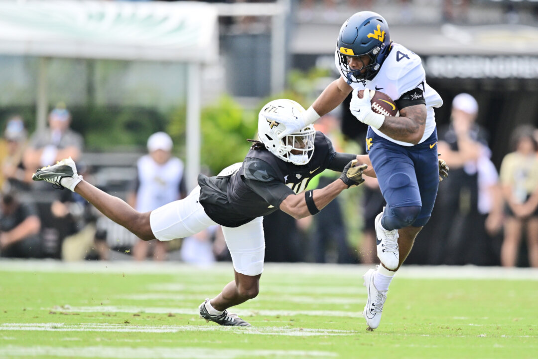 CJ Donaldson Has Two Short TD Runs, West Virginia Beats UCF 31–21 to Become Bowl Eligible