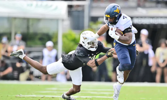 CJ Donaldson Has Two Short TD Runs, West Virginia Beats UCF 31–21 to Become Bowl Eligible
