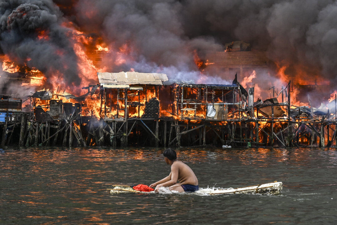 NextImg:Day in Photos: Manila Fire, Europe Elections, and Pakistani Unrest