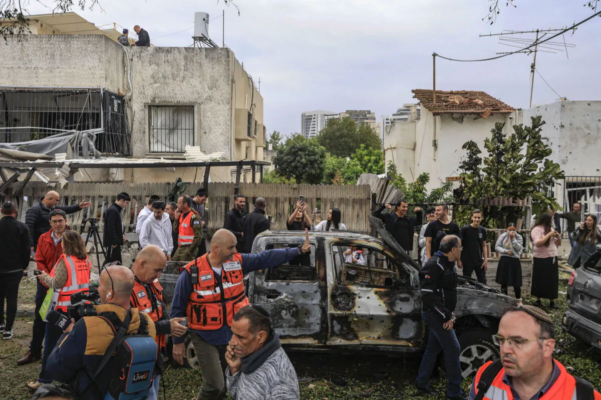 Emergency workers respond to the site of a rocket attack fired from Lebanon, in Petah Tikva, Israel, on Nov. 24, 2024. (Amir Levy/Getty Images)