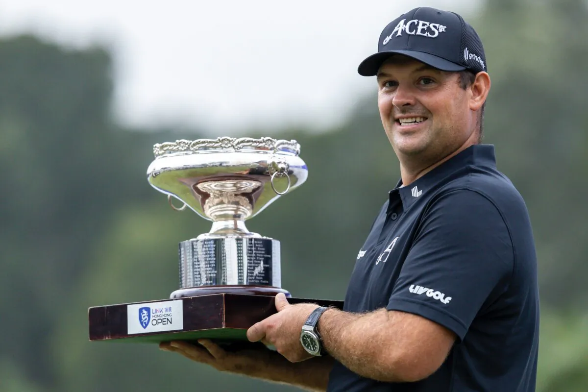 Patrick Reed of United States poses for photo with trophy after winning the final round of Link Hong Kong Open at Hong Kong Golf Club on Nov. 24, 2024 in Hong Kong. (Yu Chun Christopher Wong/Eurasia Sport Images)
