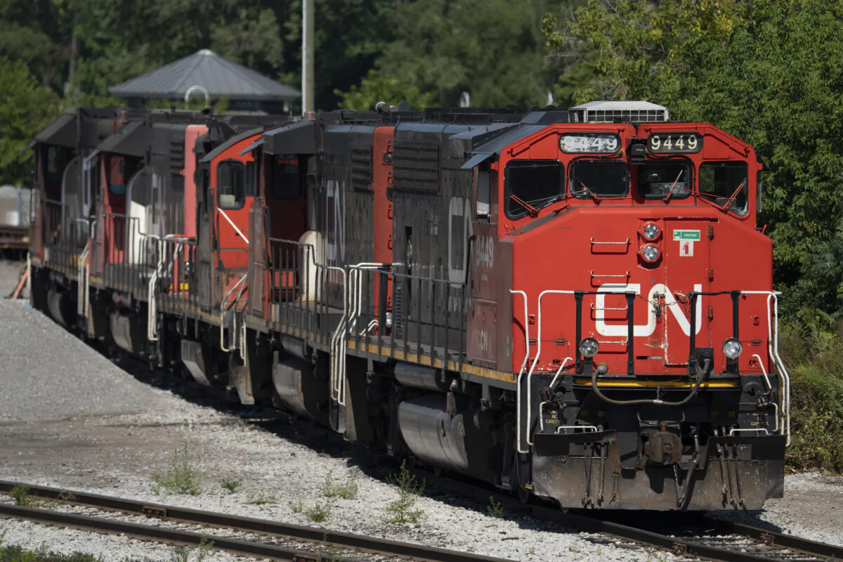 A CN locomotive sits idle at the CN Stuart Yard west of the West Harbour GO station in Hamilton, Ont., on Aug. 22, 2024. (The Canadian Press/Peter Power)