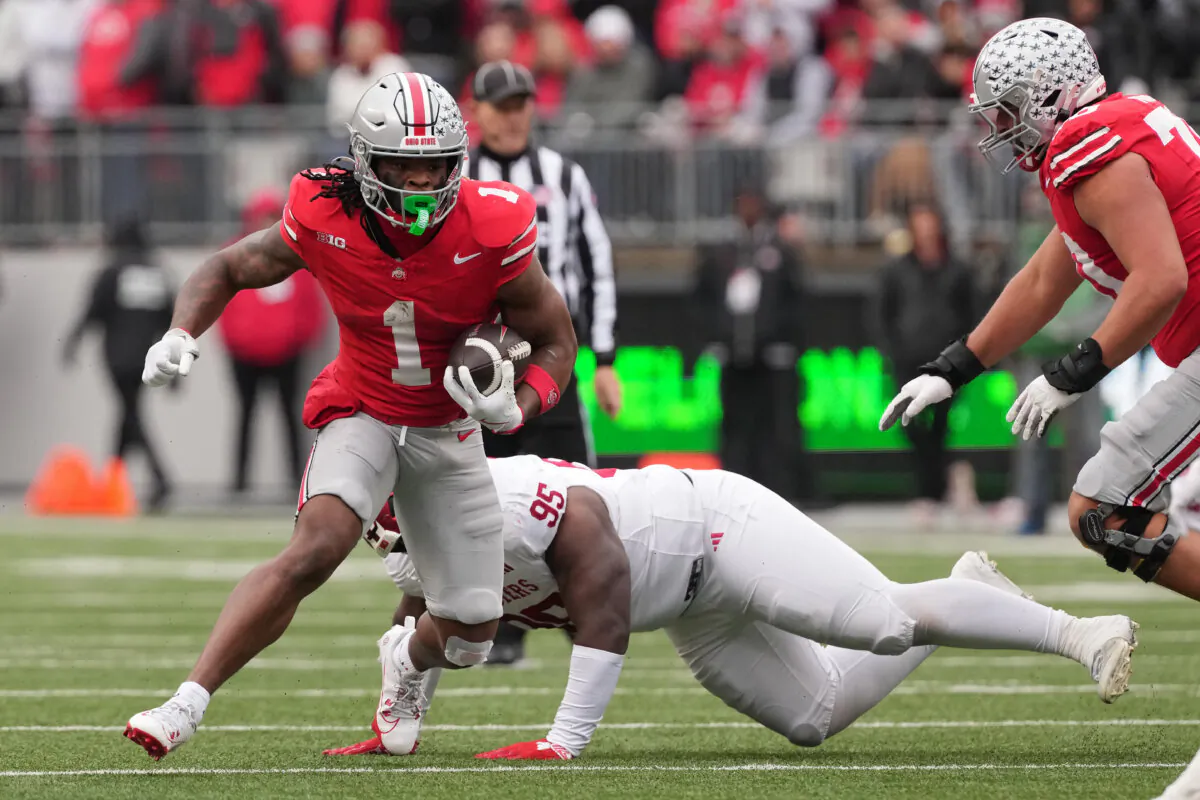Quinshon Judkins of the Ohio State Buckeyes runs with the ball past Tyrique Tucker of the Indiana Hoosiers in the third quarter at Ohio Stadium in Columbus, Ohio, on Nov. 23. (Jason Mowry/Getty Images)