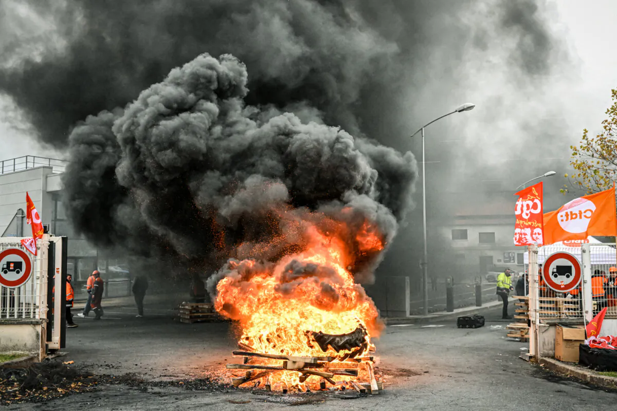 Tires burning in front of ArcelorMittal factory during a demonstration against the closure of the factory in Saint-Brice-Courcelles, France, on Nov. 25, 2024. (Francois Nascimbeni/AFP via Getty Images)