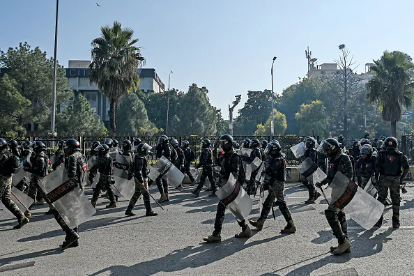 Paramilitary soldiers march along a street leading to the Red Zone area during a protest demanding the release of former prime minister Imran Khan, in Islamabad on Nov. 26, 2024. (Aamir Qureshi/AFP via Getty Images)