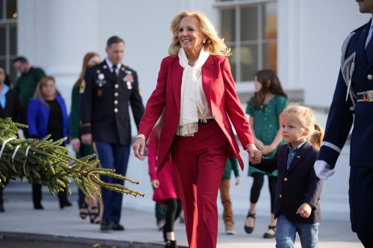 First Lady Jill Biden walks with her grandson Beau Biden Jr. as she welcomes the official 2024 White House Christmas Tree at the White House in Washington on Nov. 25, 2024. (Andrew Harnik/Getty Images)