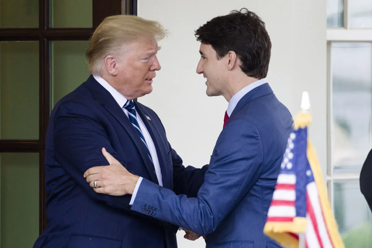President Donald Trump (L) greets Canadian Prime Minister Justin Trudeau upon his arrival at the White House on June 20, 2019. (Alex Brandon/AP Photo)