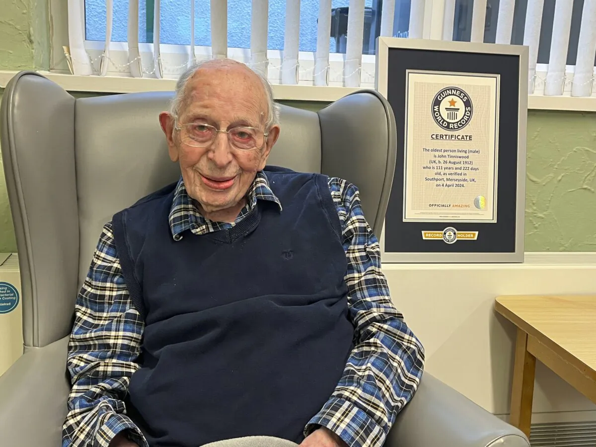 John Alfred Tinniswood poses for a photo on April 4, 2024. The world’s oldest man has died in England at age 112. The family of John Alfred Tinniswood said he died Monday, Nov. 25, 2024 at a care home outside Liverpool, where he was born in 1912. (Guinness World Records via AP)