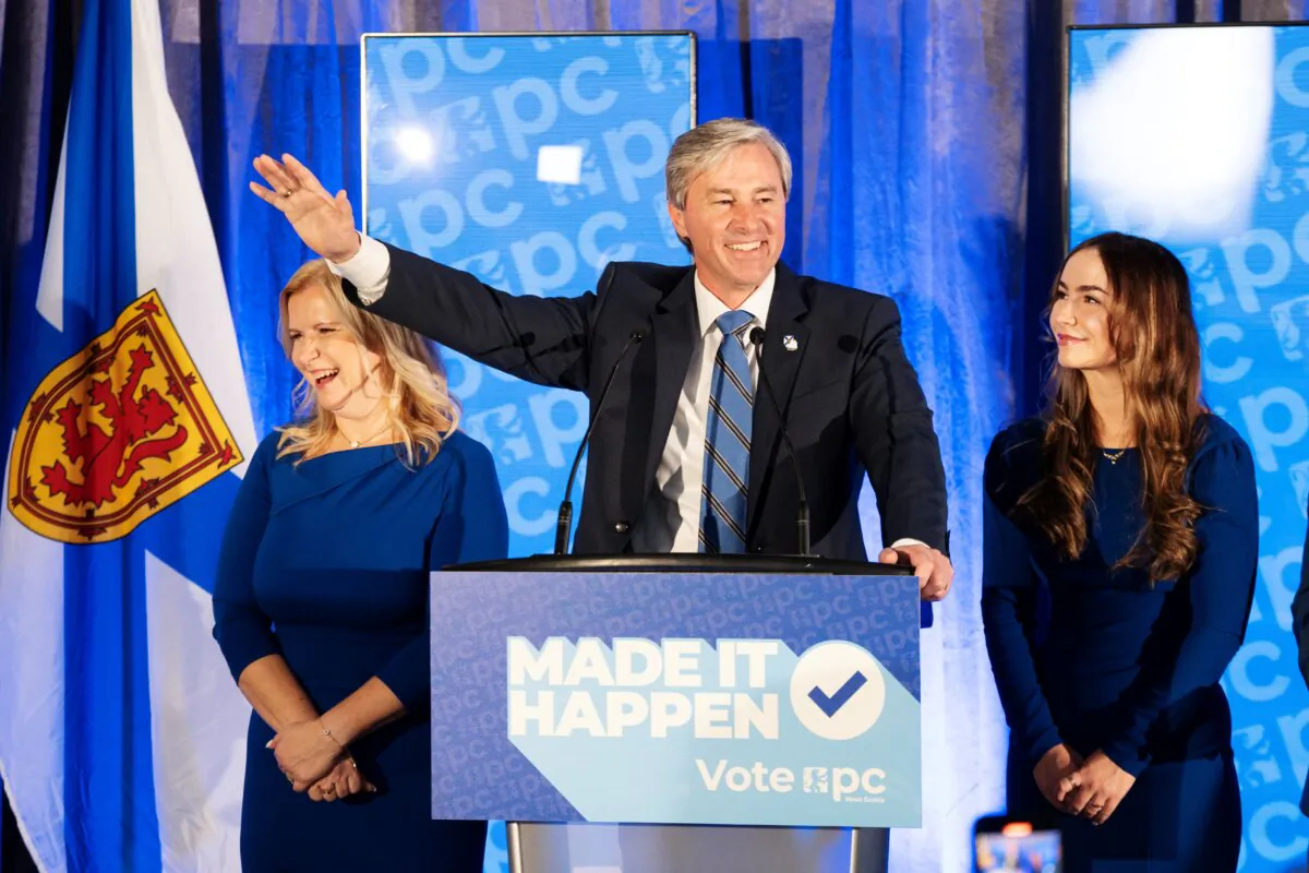 Nova Scotia Premier and Progressive Conservative Leader Tim Houston celebrates with his family at the PC party election headquarters in New Glasgow, N.S., on Nov. 26, 2024. (The Canadian Press/Darren Calabrese)
