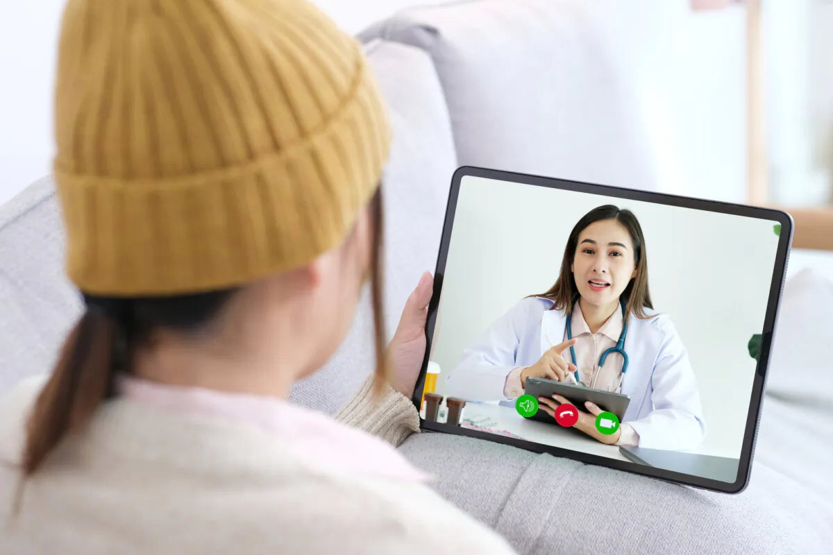 Woman patient makes a video call to a doctor about healthcare by digital tablet, Telemedicine. (mangpor_2004/Depositphotos)