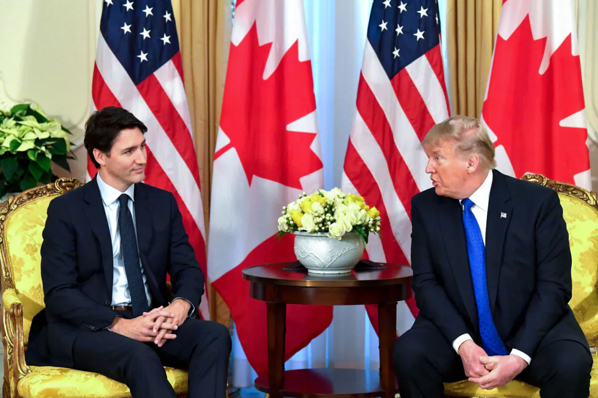 U.S. President Donald Trump (R) talks with Canada's Prime Minister Justin Trudeau during a meeting at Winfield House, London, on Dec. 3, 2019. (Nicholas KammAFP via Getty Images)