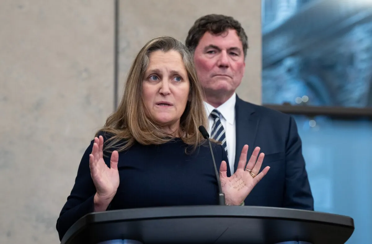 Public Safety Minister Dominic LeBlanc looks on as Deputy Prime Minister Chrystia Freeland speaks to reporters after a cabinet meeting on Parliament Hill on Nov. 26, 2024. (The Canadian Press/Adrian Wyld)