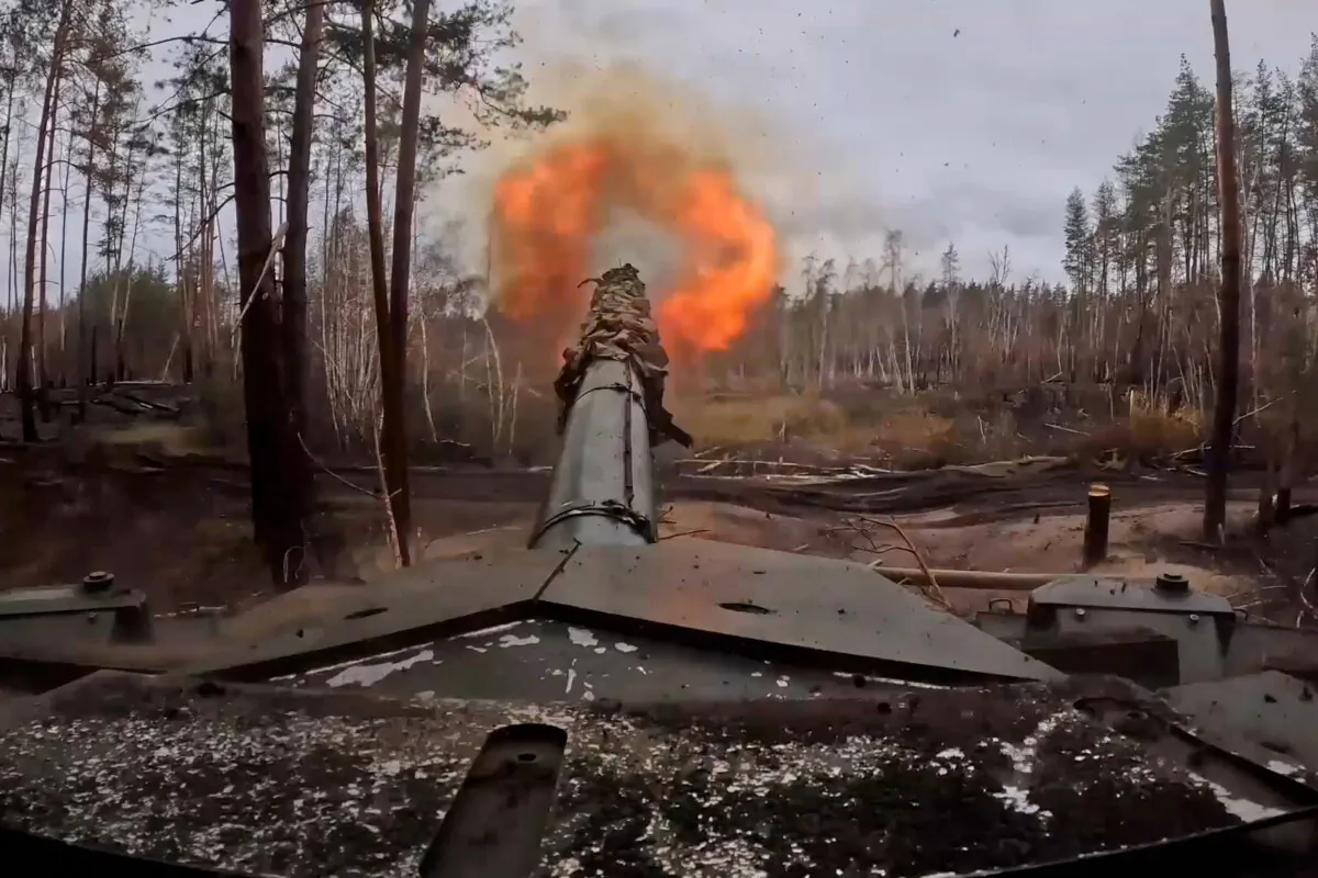 A Russian tank fires toward Ukrainian positions on Nov. 22, 2024. (Russian Defense Ministry Press Service via AP)
