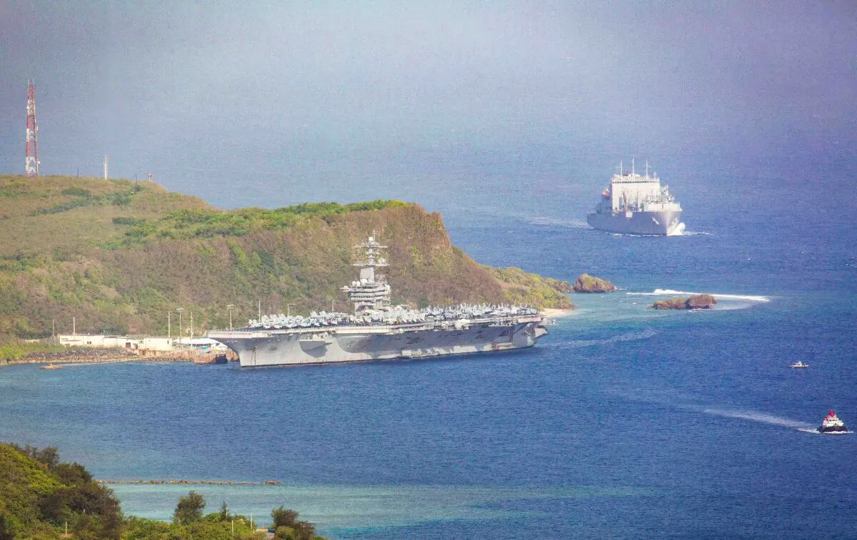 The aircraft carrier USS Theodore Roosevelt is docked at Naval Base Guam in Apra Harbor amid the coronavirus pandemic on April 27, 2020. (Tony Azios/AFP via Getty Images)