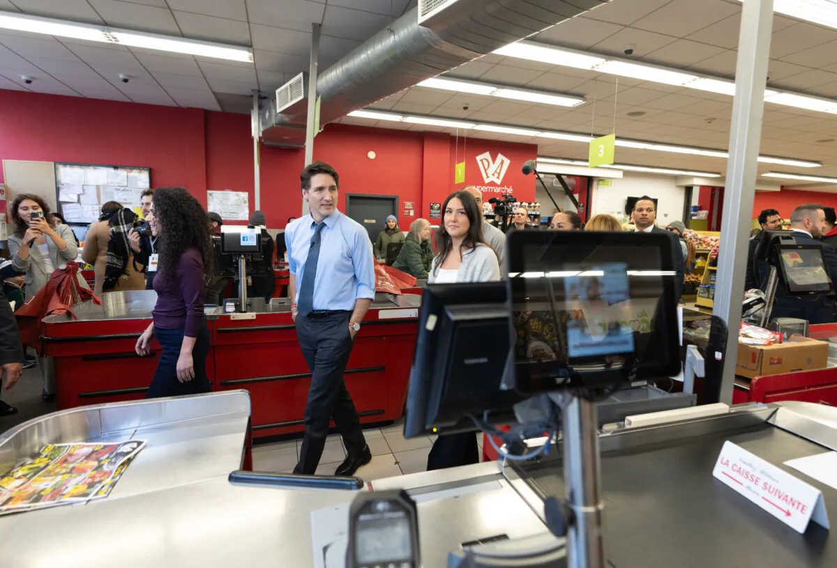 Prime Minister Justin Trudeau walks through the check out aisle as he tours Supermarche PA du Parc in Montreal on Nov. 25, 2024. (The Canadian Press/Christinne Muschi)
