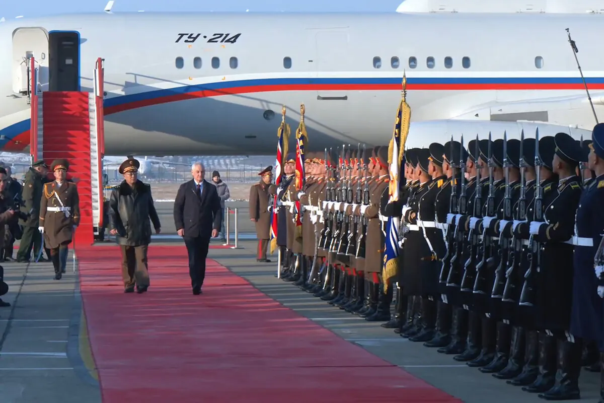 Russian Defense Minister Andrei Belousov, (R, on the red carpet), is welcomed by North Korean Defense Minister No Kwang Chol (L on red carpet), upon his arrival at Pyongyang International Airport in Pyongyang, North Korea on Nov. 29, 2024. (Russian Defense Press Service via AP)
