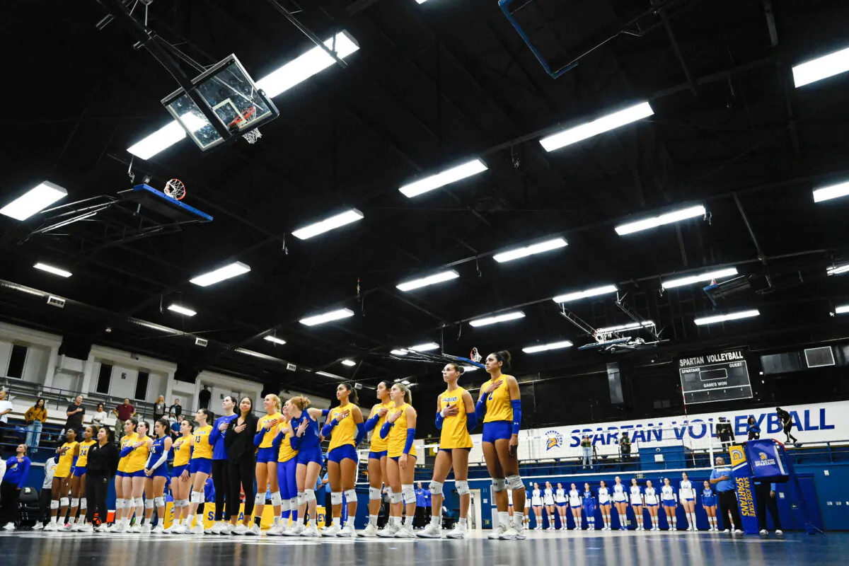 The San Jose State Spartans and Air Force Falcons stand for the National Anthem before an NCAA college volleyball match in San Jose, Calif., on Oct. 31, 2024 (Eakin Howard/AP Photo)
