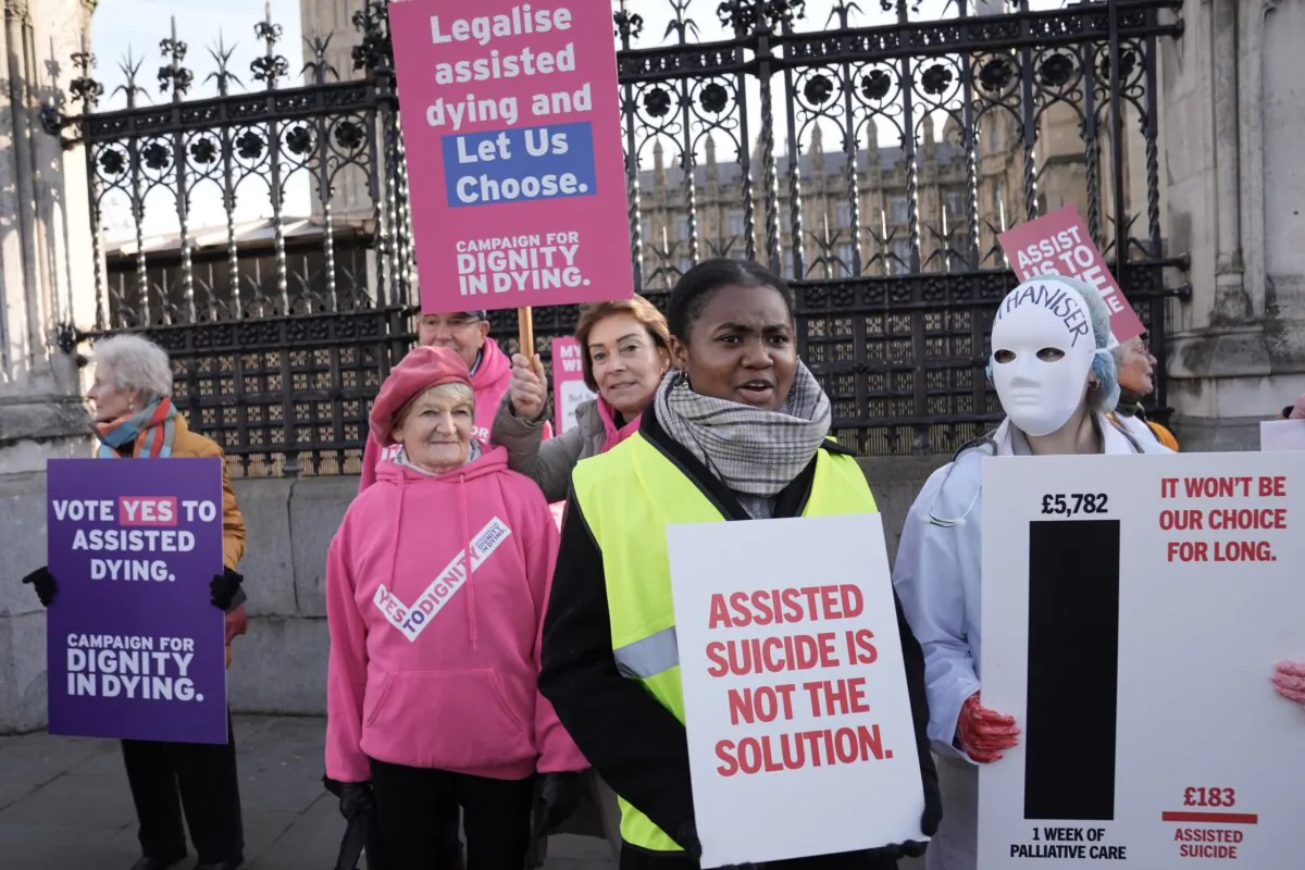 Protesters photographed outside of Parliament ahead of the vote on assisted dying, in London, on Nov. 29, 2024. (PA)