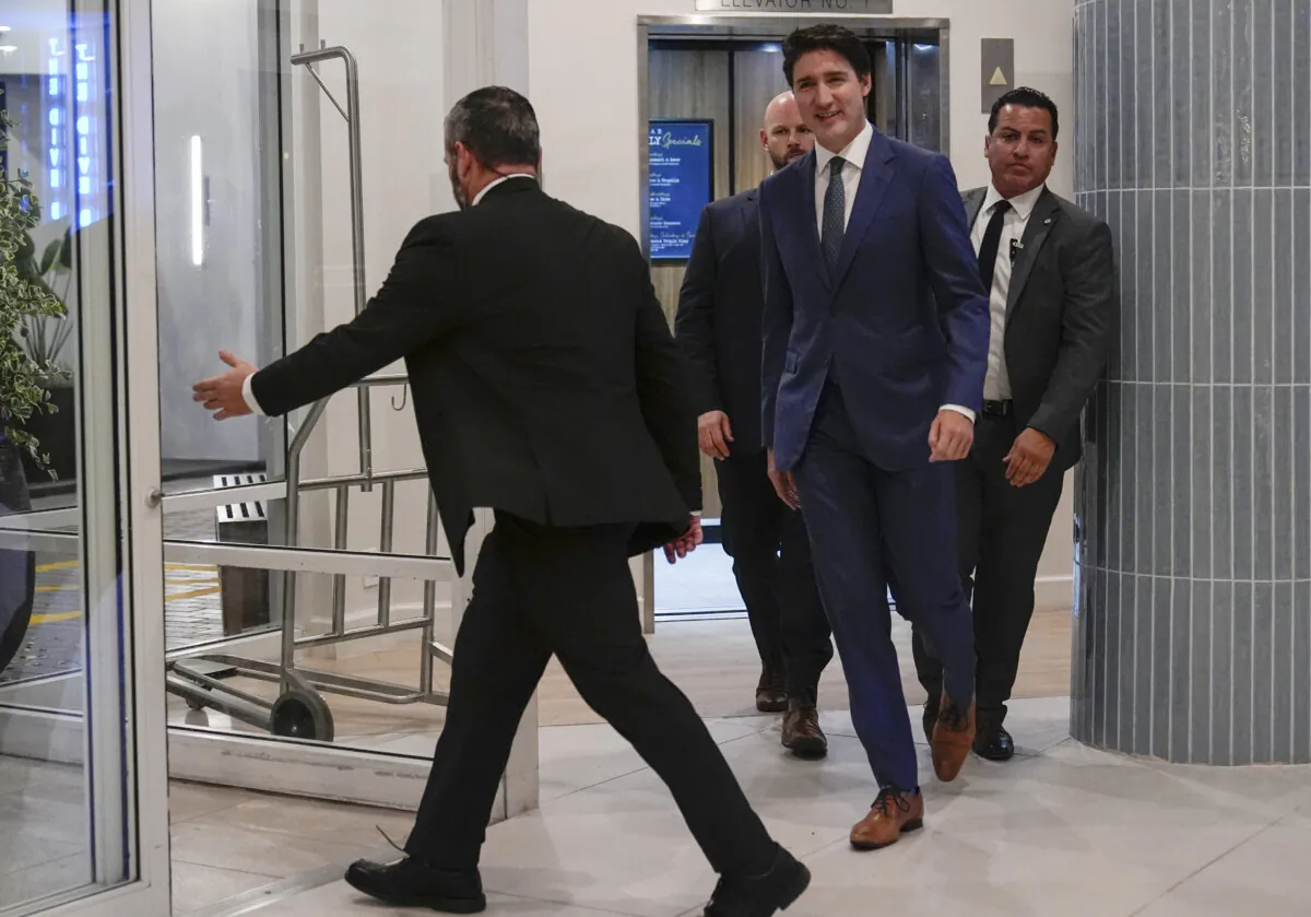 Canadian Prime Minister Justin Trudeau walks through the lobby of the Delta Hotel by Marriott in West Palm Beach, Fla., on Nov. 29, 2024. (AP Photo/Carolyn Kaster)