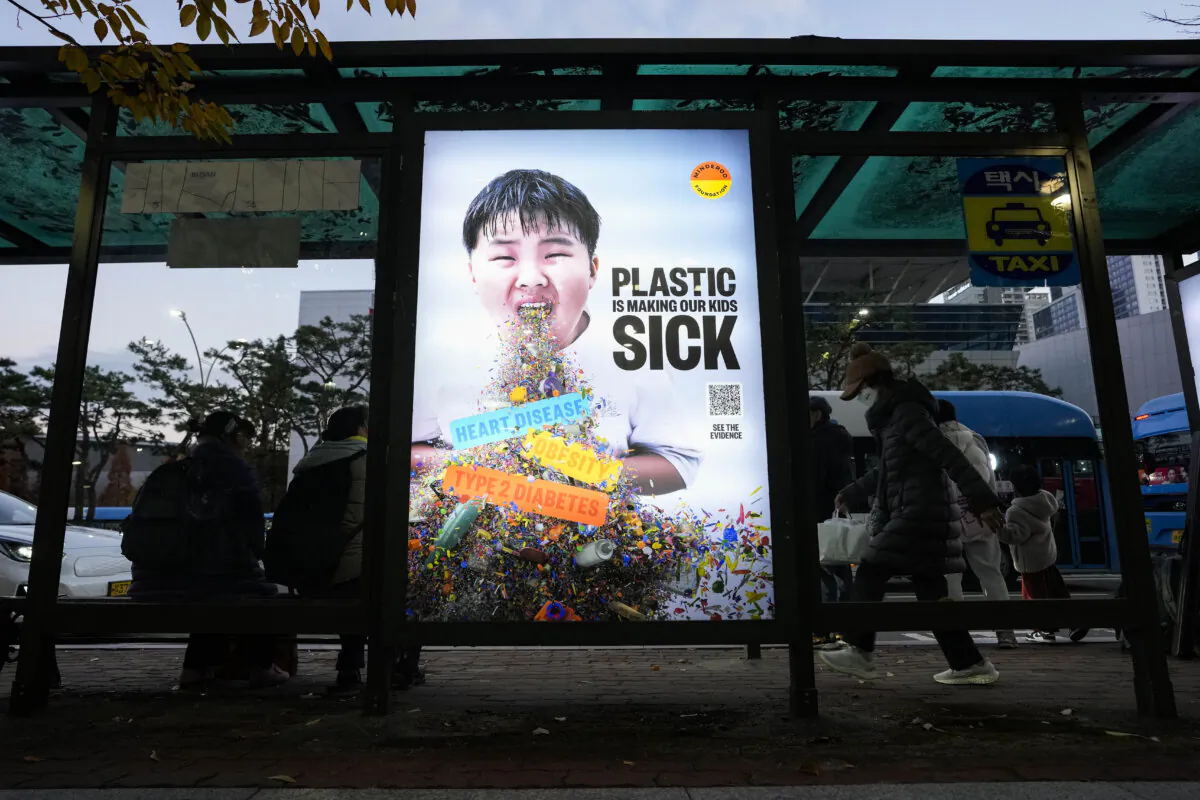 A display board shows a call for a reduction in plastic production during the fifth session of the Intergovernmental Negotiating Committee on Plastic Pollution, at a taxi station in Busan, South Korea. on Nov. 30, 2024. (Ahn Young-joon/AP Photo)