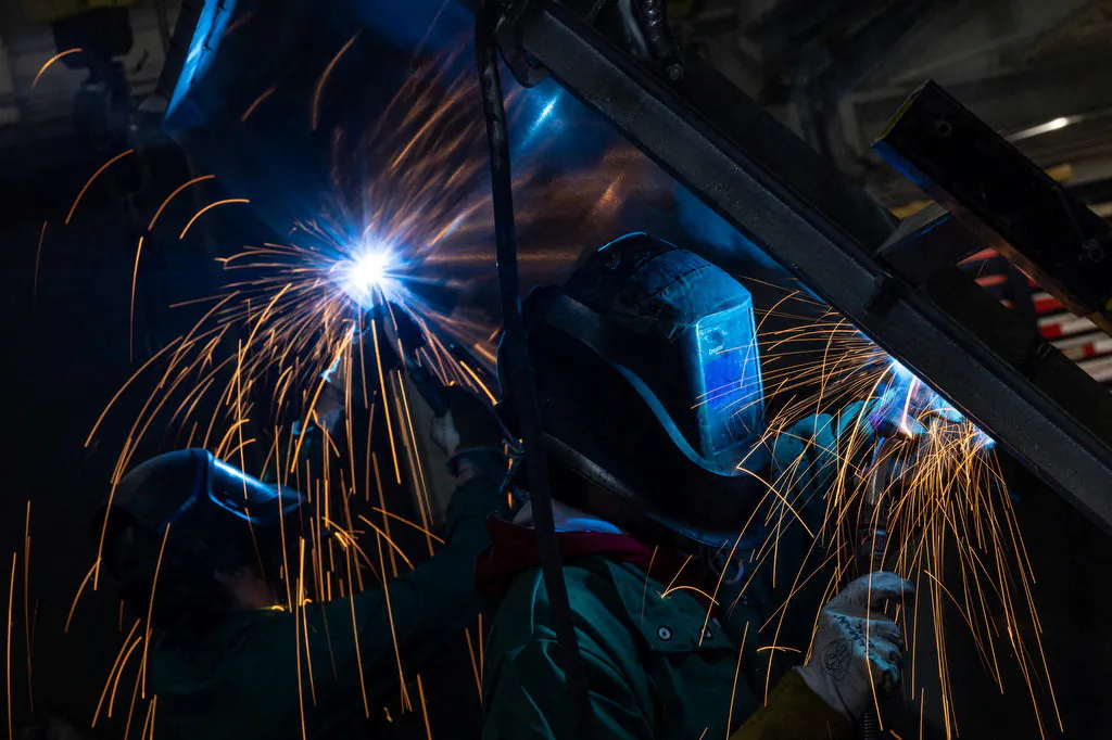 Workers weld at a factory floor in Columbus, Ohio, U.S., March 26, 2024. (Carlos Barria/Reuters)