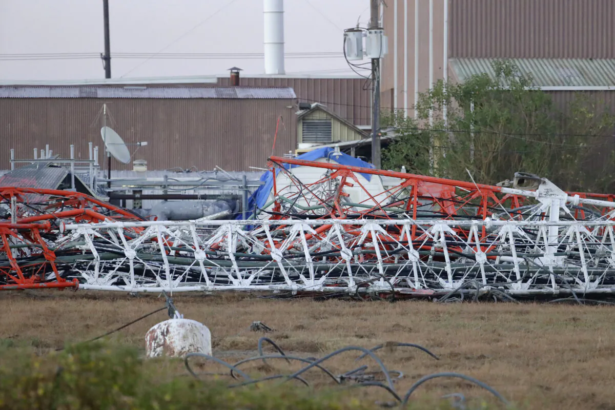 The north side of the collapsed radio tower where a helicopter collided with the structure, killing all aboard in Houston on Oct. 21, 2024. (Michael Wyke/Houston Chronicle via AP)