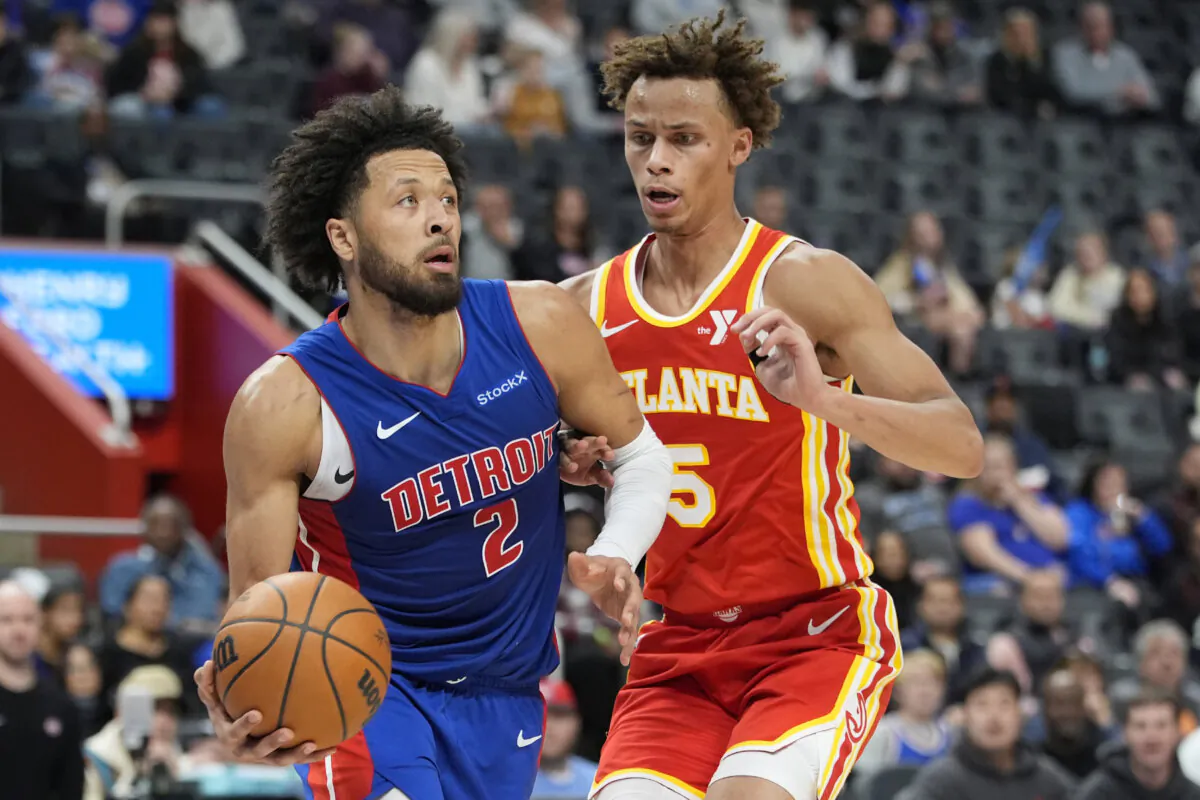 Detroit Pistons guard Cade Cunningham (2) is defended by Atlanta Hawks guard Dyson Daniels (5) during the first half of an NBA basketball game in Detroit, on Nov. 8, 2024. (Carlos Osorio/AP Photo)