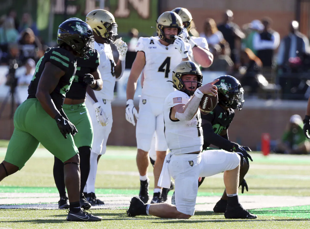 Army quarterback Bryson Daily (13) gestures after a first down against North Texas in the first half of an NCAA football game Saturday, Nov. 9, 2024, in Denton, Texas. (AP Photo/Richard W. Rodriguez)