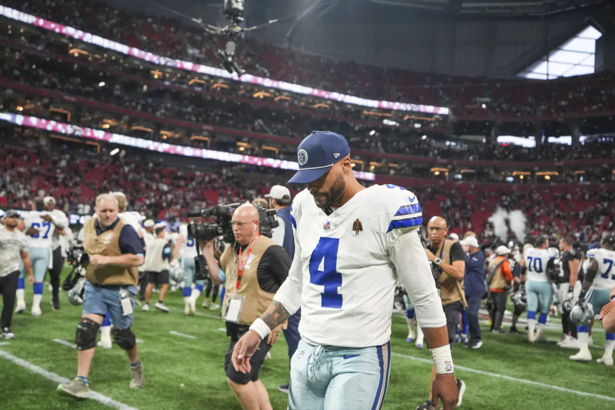 Dallas Cowboys quarterback Dak Prescott (4) walks off the field after an NFL football game against the Atlanta Falcons, Sunday, Nov. 3, 2024, in Atlanta. The Falcons won 27-21. (AP Photo/ Brynn Anderson)
