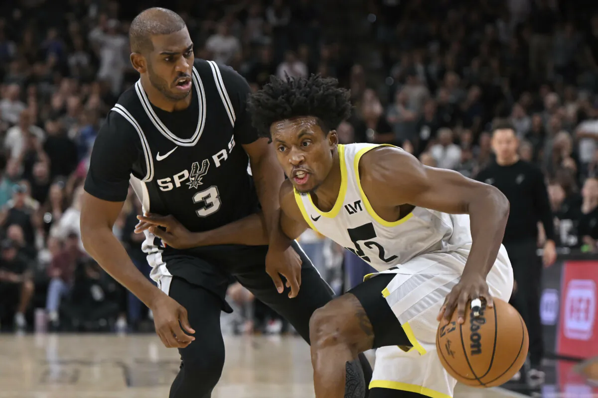 Utah Jazz's Collin Sexton (2) drives against San Antonio Spurs' Chris Paul during the second half of an NBA basketball game, Saturday, Nov. 9, 2024, in San Antonio. Utah won 111–110. (Darren Abate/AP Photo)