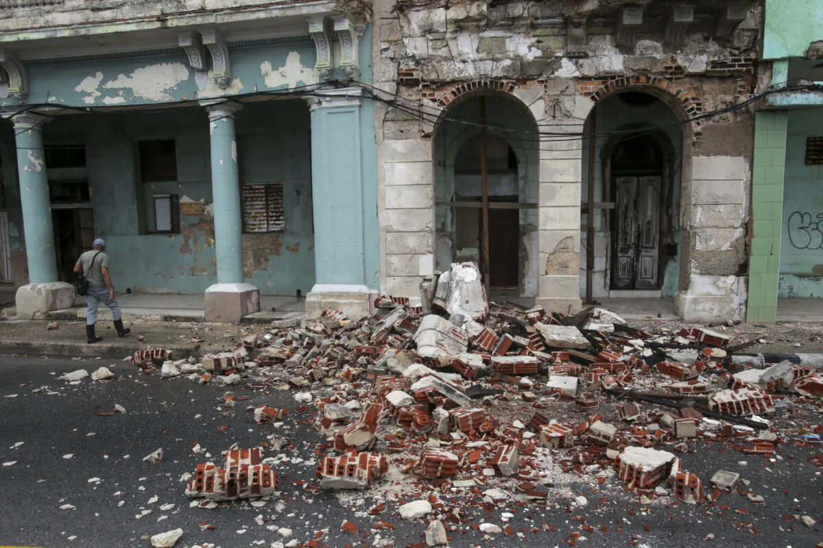 Debris from a building damaged by the passage of Hurricane Rafael covers the street in Havana, Cuba, on Nov. 7, 2024. (Ariel Ley/AP Photo)