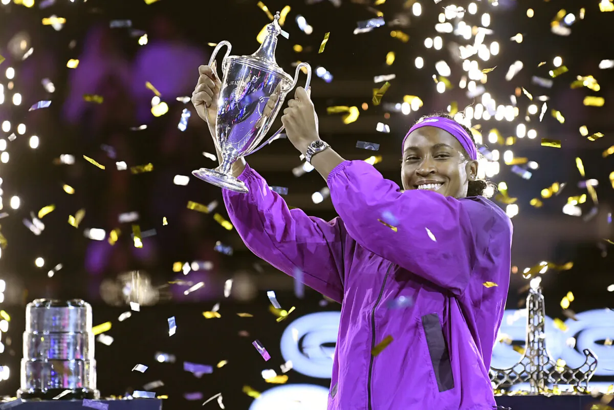 Coco Gauff of the United States holds her trophy after winning against China's Qinwen Zheng in their women's singles final match of the WTA finals at the King Saud University Indoor Arena in Riyadh, Saudi Arabia, on Nov. 9, 2024. (AP Photo)
