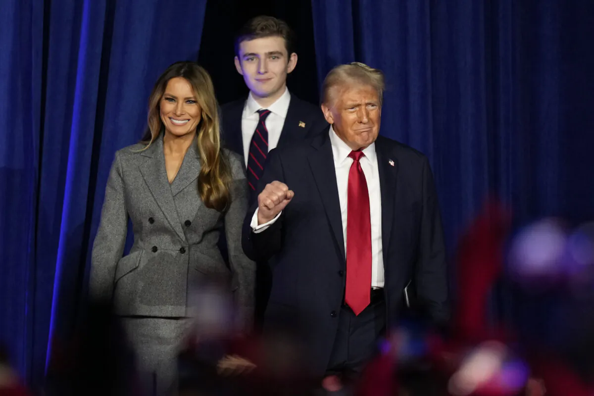 Republican presidential nominee former President Donald Trump (R), joined by former First Lady Melania Trump (L) and their son, Barron Trump, arrives to speak at an election night watch party in West Palm Beach, Fla., on Nov. 6, 2024. (Alex Brandon/AP Photo)