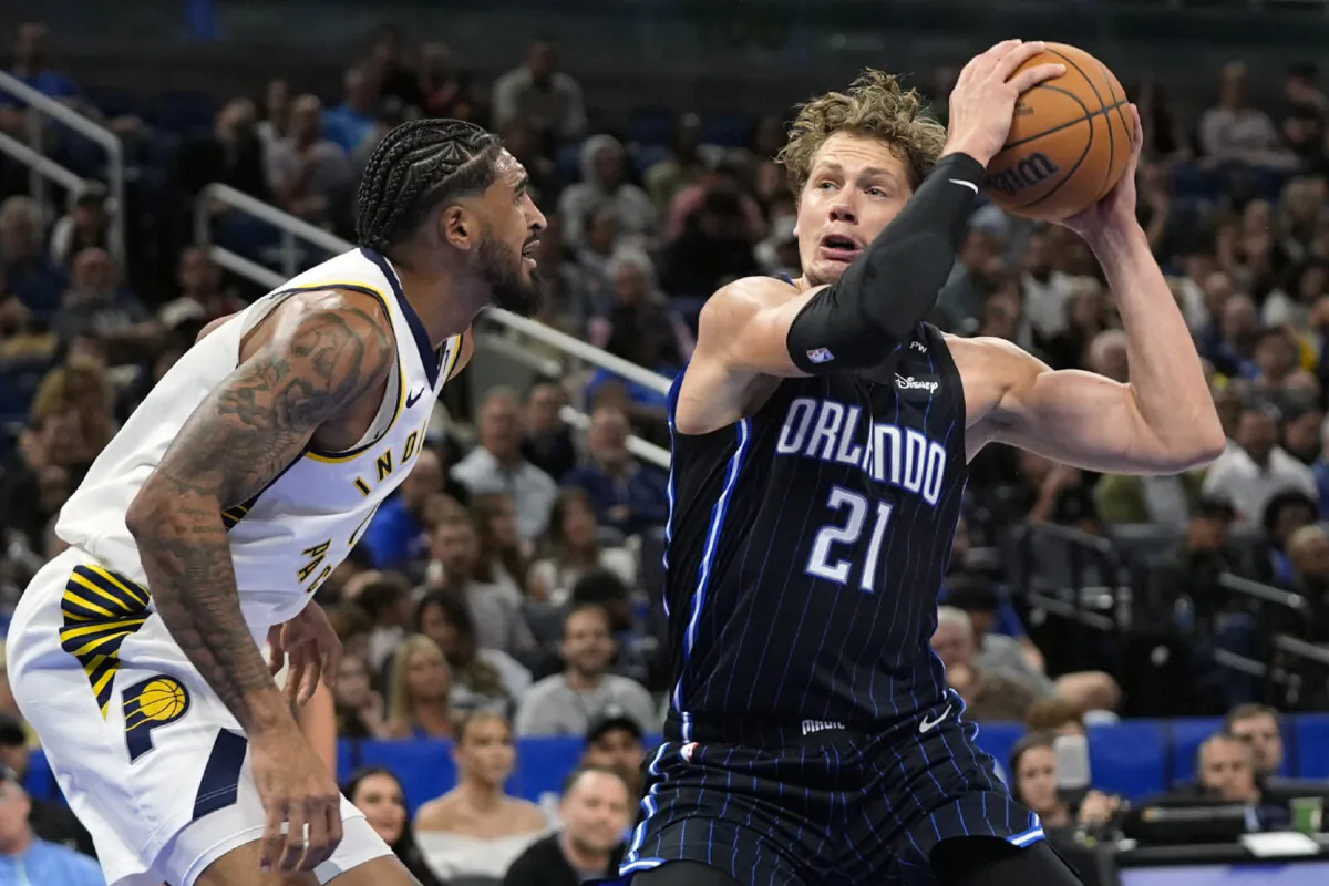 Orlando Magic center Moritz Wagner (21) looks for a shot against Indiana Pacers forward Obi Toppin, left, during the first half of an NBA basketball game, Wednesday, Nov. 13, 2024, in Orlando, Fla. (John Raoux/AP Photo)