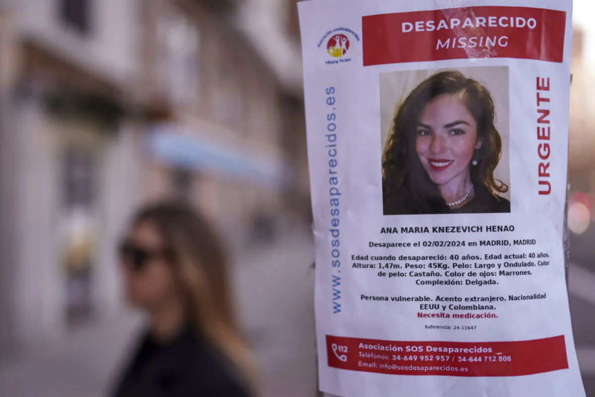 A missing poster for Colombian-born, American Ana Maria Knezevich Henao is displayed on a streetlight in Madrid, Spain, on Feb. 16, 2024. (Manu Fernandez/AP Photo)