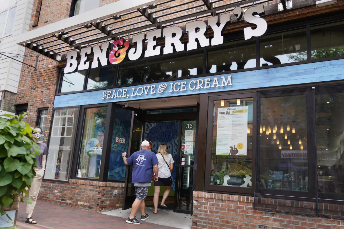 Two patrons enter the Ben & Jerry's Ice Cream shop in Burlington, Vt., on July 20, 2021. (Charles Krupa/AP Photo)