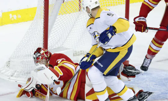 Wolf Makes 29 Saves for First Career Shutout as Flames Beat Predators 2-0