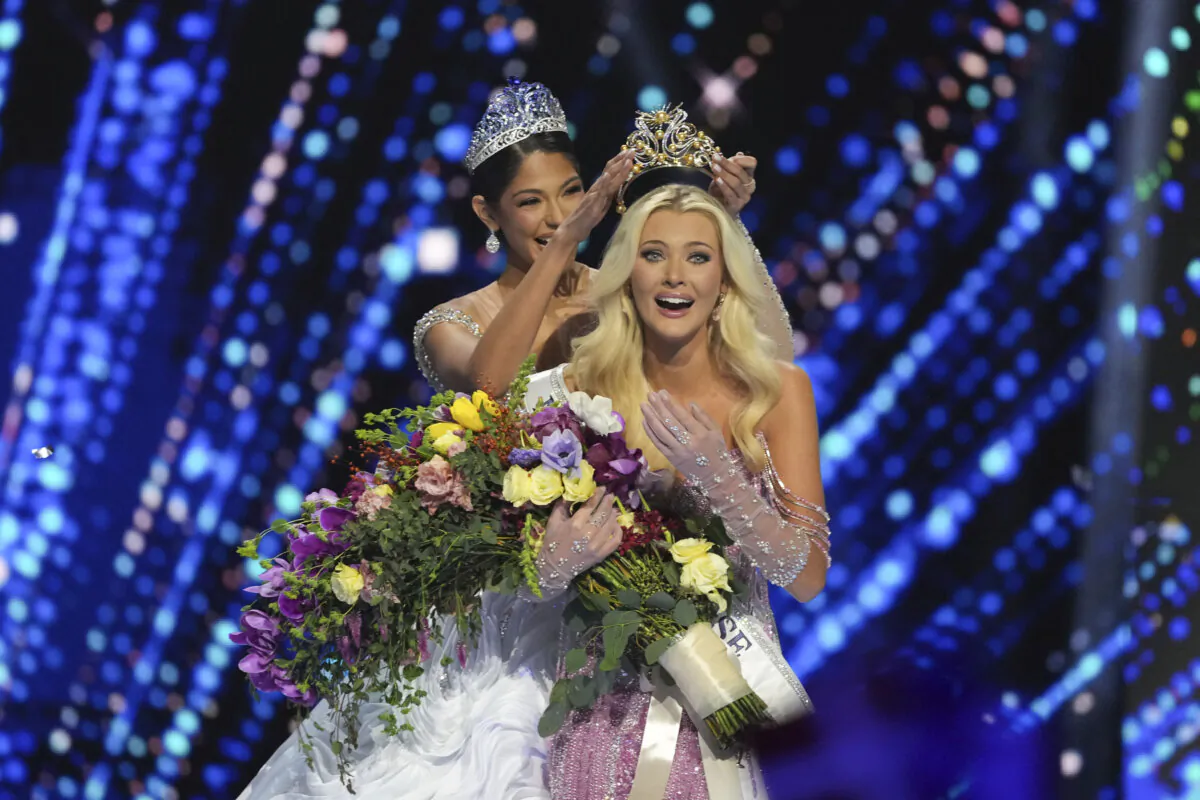 Miss Denmark Victoria Kjær Theilvig (R) receives the crown after winning the 73rd Miss Universe Beauty Pageant in Mexico City on Nov. 16, 2024. (Fernando Llano/AP Photo)