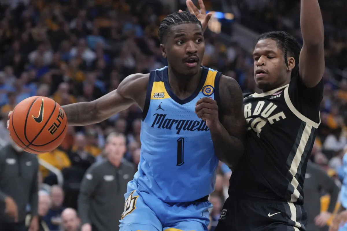 Marquette's Kam Jones tries to get pants Purdue's Gicarri Harris during the first half of an NCAA college basketball game in Milwaukee, on Nov. 19, 2024. (Morry Gash/AP Photo)