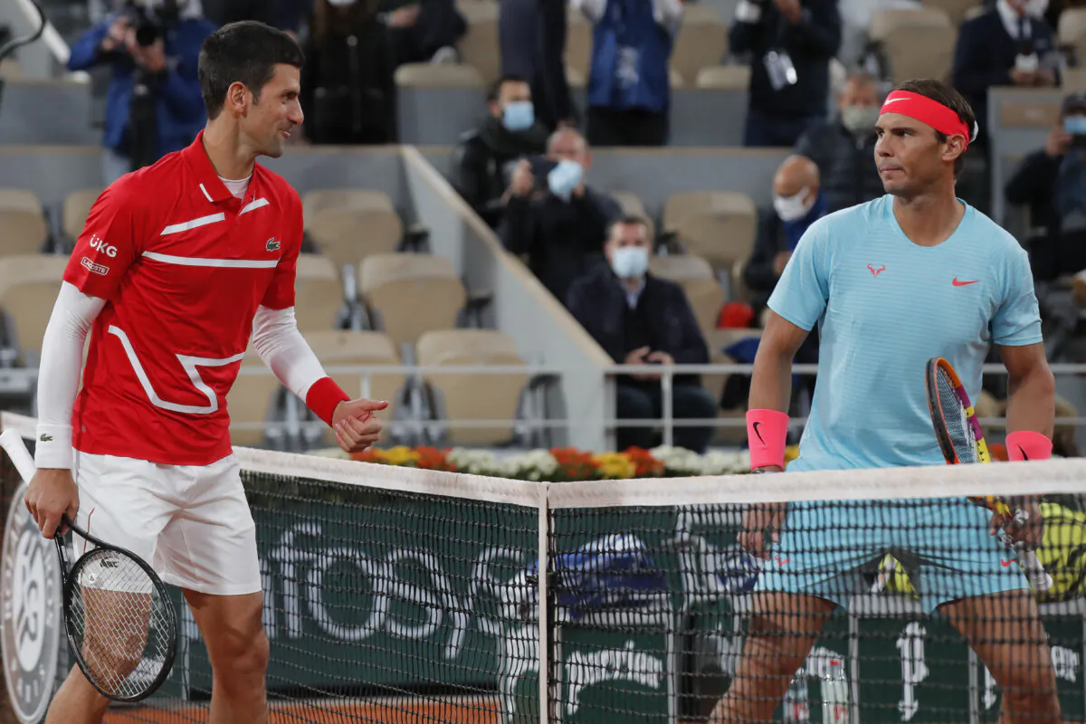 Serbia's Novak Djokovic, left, and Spain's Rafael Nadal look at each other as they pose for images prior to the final match of the French Open tennis tournament at Roland Garros stadium in Paris, France, Sunday, Oct. 11, 2020. (Michel Euler/AP Photo)
