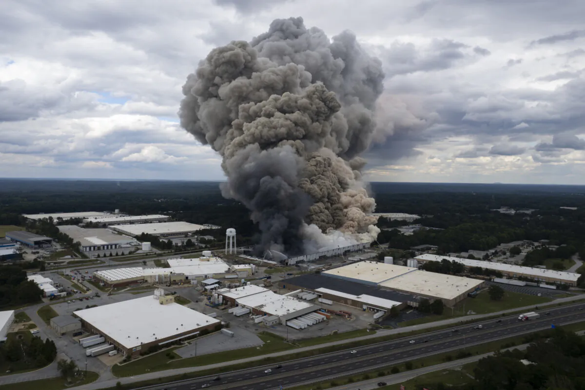 Smoke billows from a fire at the BioLab facility in Conyers, Ga., on Sept. 29, 2024. (Ben Gray/Atlanta Journal-Constitution via AP)