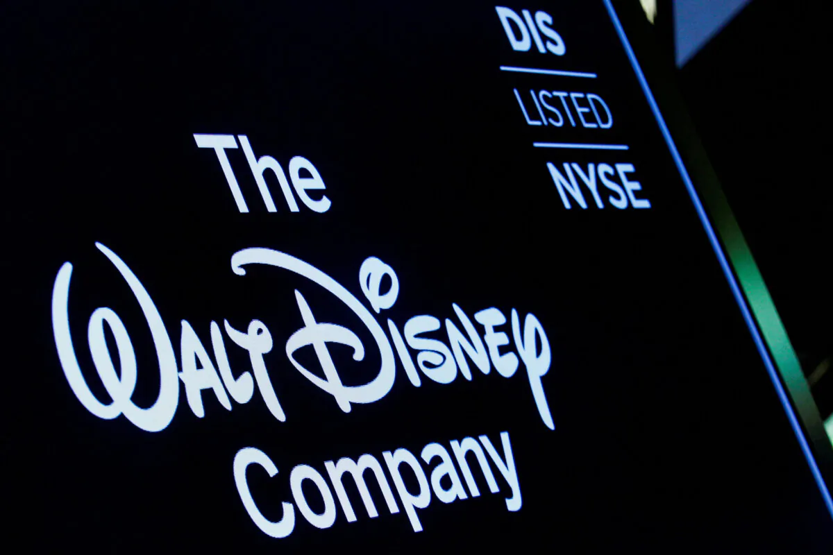 A screen shows the logo and a ticker symbol for The Walt Disney Company on the floor of the New York Stock Exchange (NYSE) in New York on Dec. 14, 2017. (Brendan McDermid/Reuters)