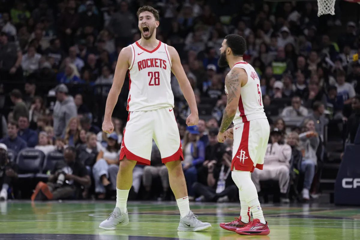 Houston Rockets center Alperen Sengun (28) celebrates next to guard Fred VanVleet (5) after making a shot during overtime of an Emirates NBA cup basketball game against the Minnesota Timberwolves in Minneapolis, on Nov. 26, 2024. (Abbie Parr/AP Photo)