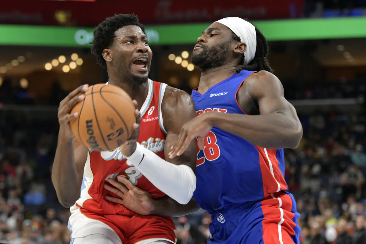 Memphis Grizzlies forward Jaren Jackson Jr. (13) handles the ball against Detroit Pistons center Isaiah Stewart (28) in the first half of an NBA basketball game Wednesday, Nov. 27, 2024, in Memphis, Tenn. (Brandon Dill/AP Photo)