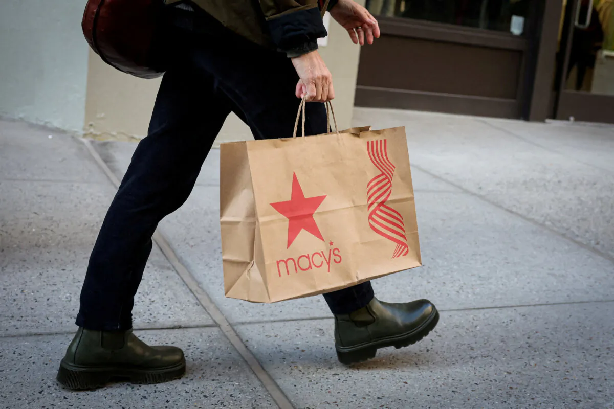 A shopper walks on 5th Avenue shopping district during the holiday season in New York on Nov. 25, 2024. (Brendan McDermid/Reuters)
