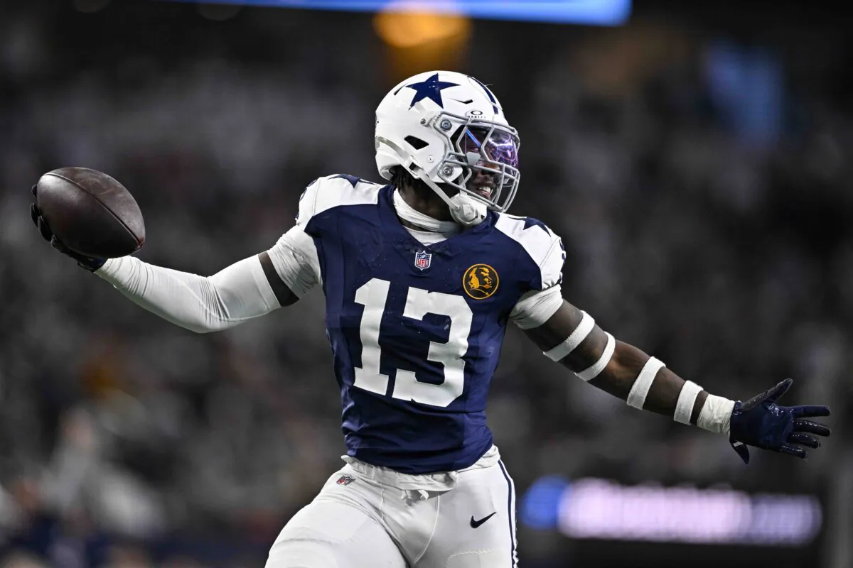Dallas Cowboys linebacker DeMarvion Overshown (13) celebrates as he runs in for a touchdown on an interception against the New York Giants during the first half of an NFL football game in Arlington, Texas, Thursday, Nov. 28, 2024. (Jerome Miron/AP Photo)