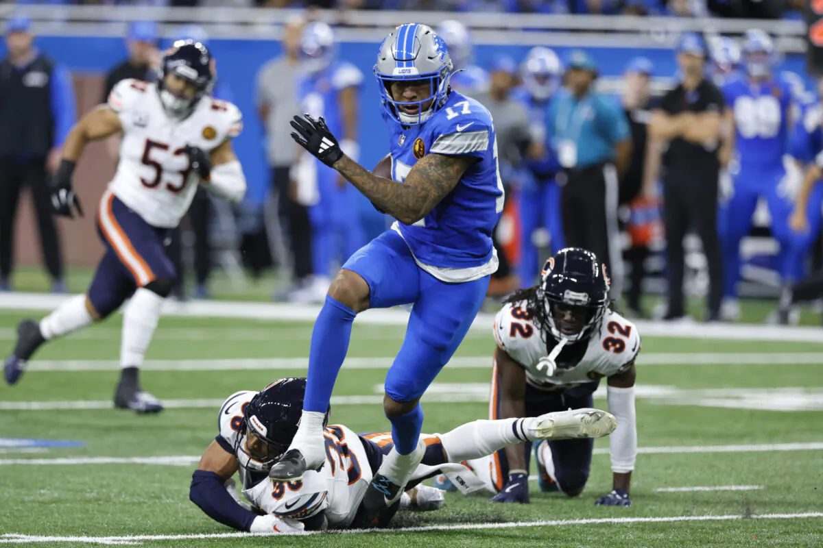 Detroit Lions wide receiver Tim Patrick (17) escapes the tackle of Chicago Bears safety Jonathan Owens (36) during the first half of an NFL football game in Detroit on Nov. 28, 2024. (Duane Burleson/AP Photo)